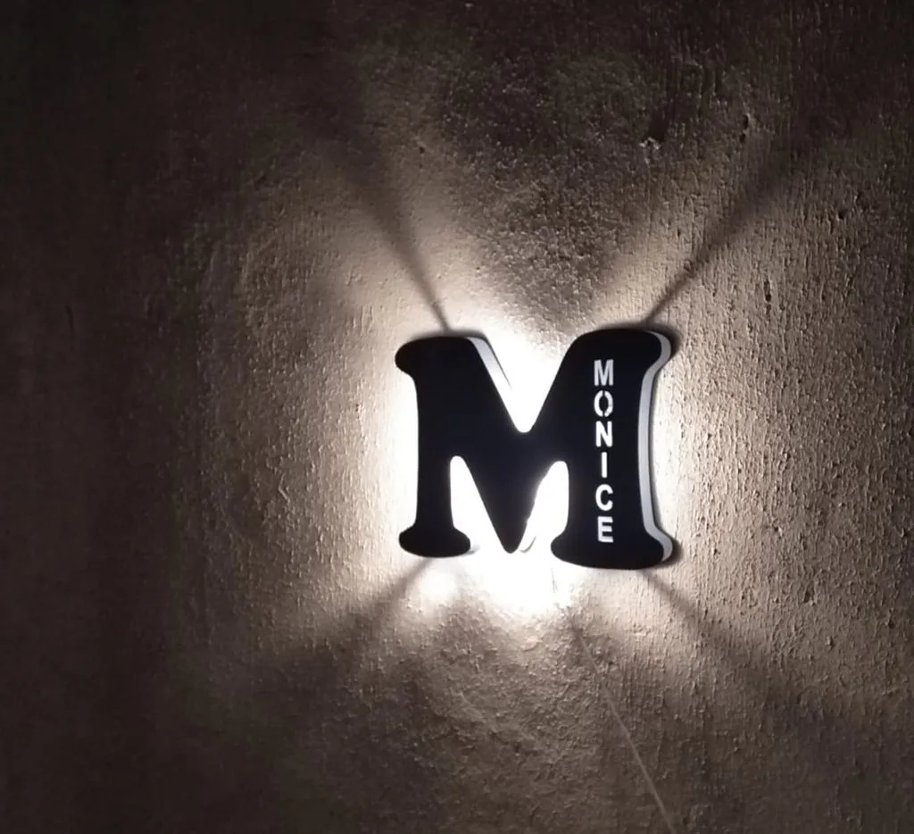 Backlit custom business logo sign on an interior wall