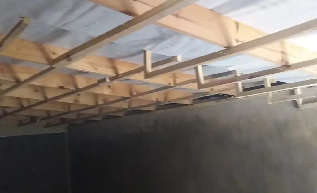 Timber roof framing above interior walls under construction