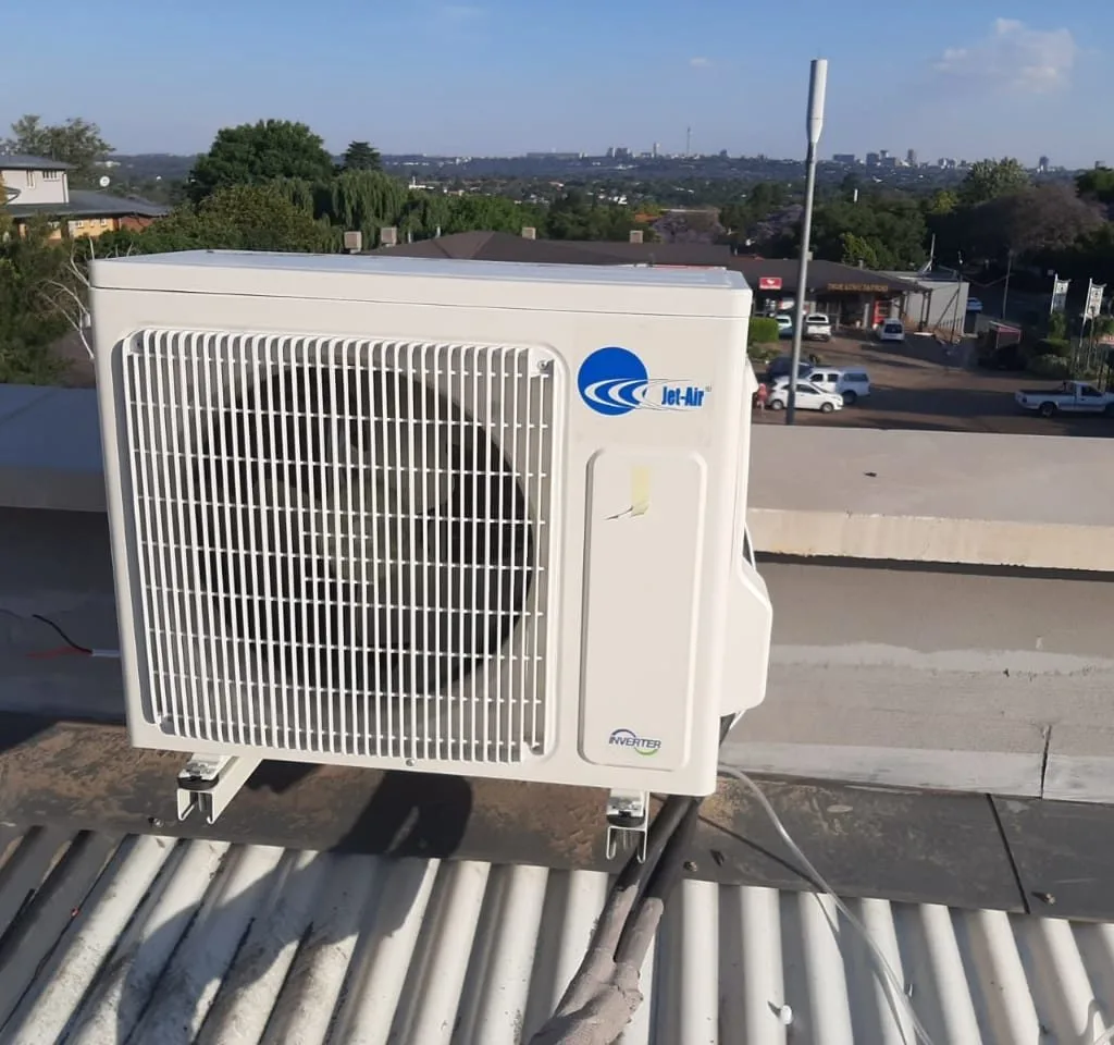 Outdoor aircon condenser installed on a rooftop