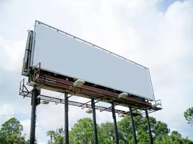 Steel roadside billboard with a blank advertising panel