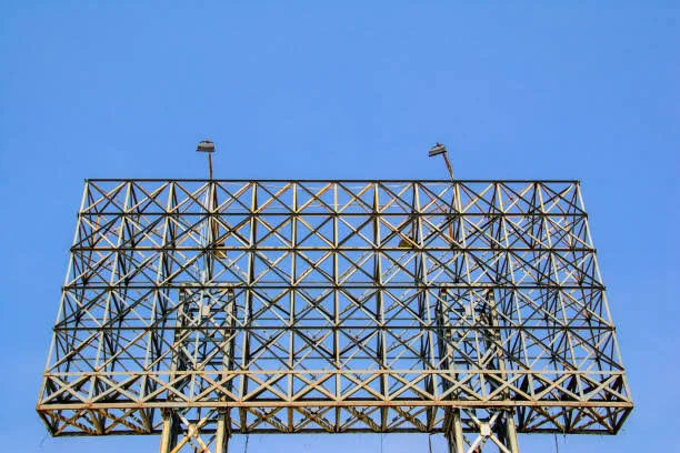 Steel billboard lattice frame with lighting fixtures