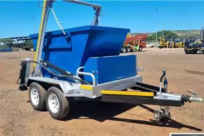 Blue skip bin trailer with raised lifting arm