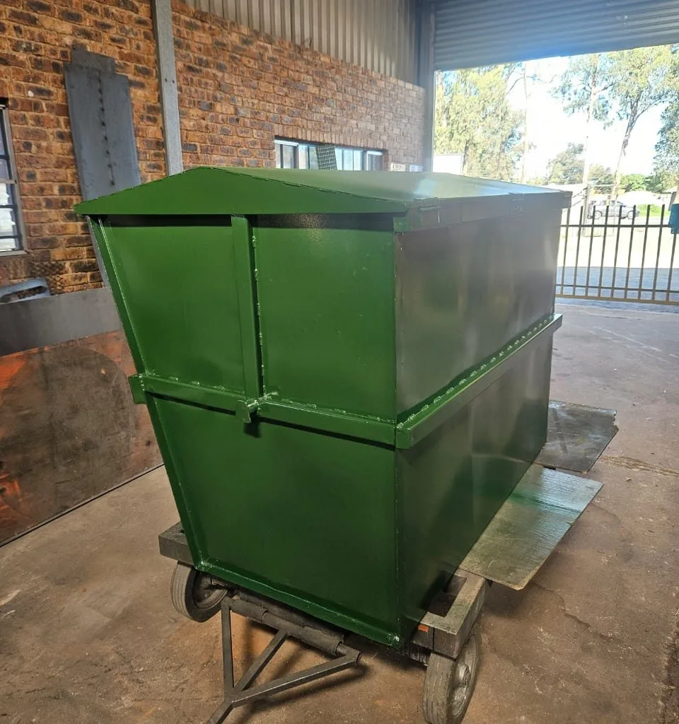 Green steel mobile waste bin on a wheeled frame