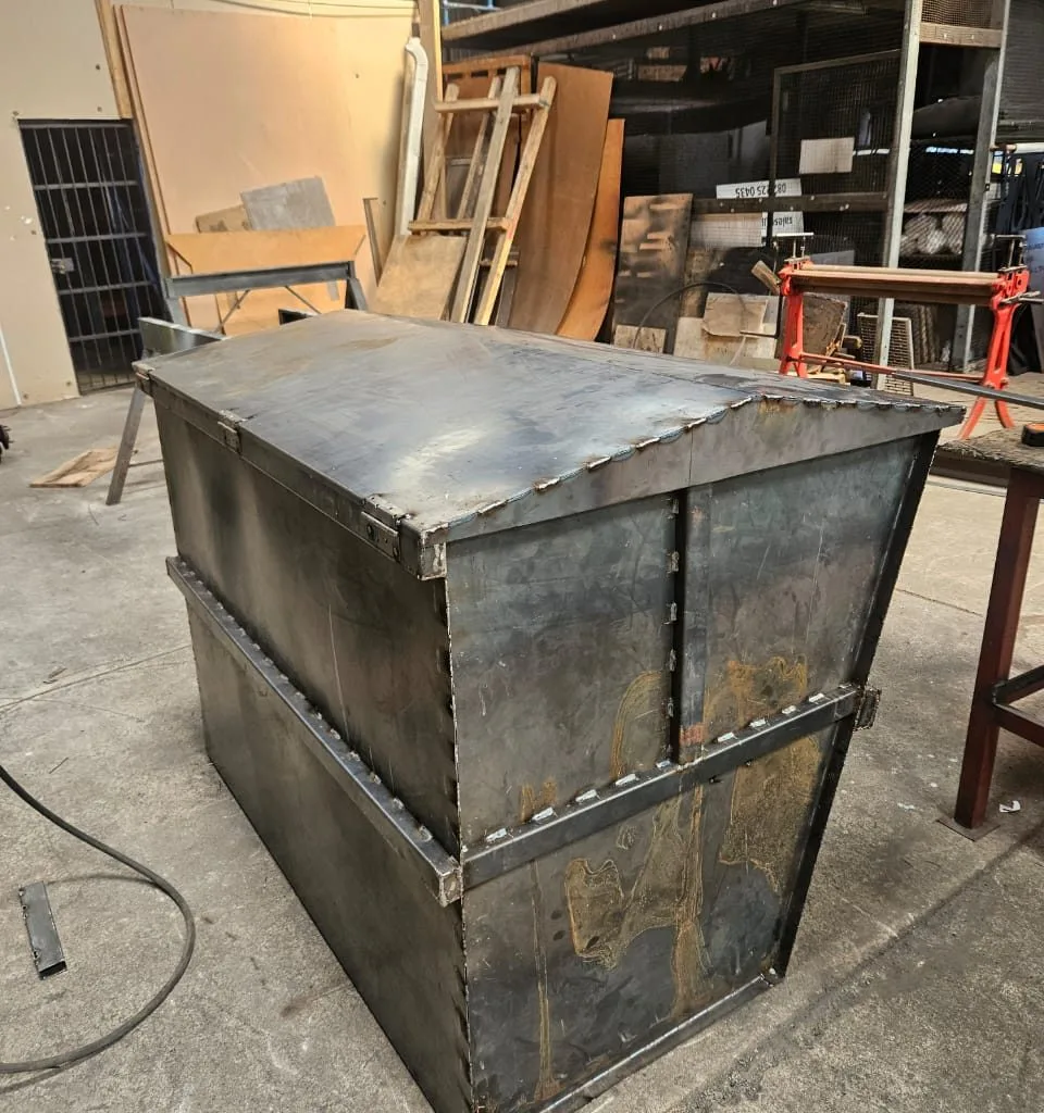 Steel mobile waste bin inside a fabrication workshop