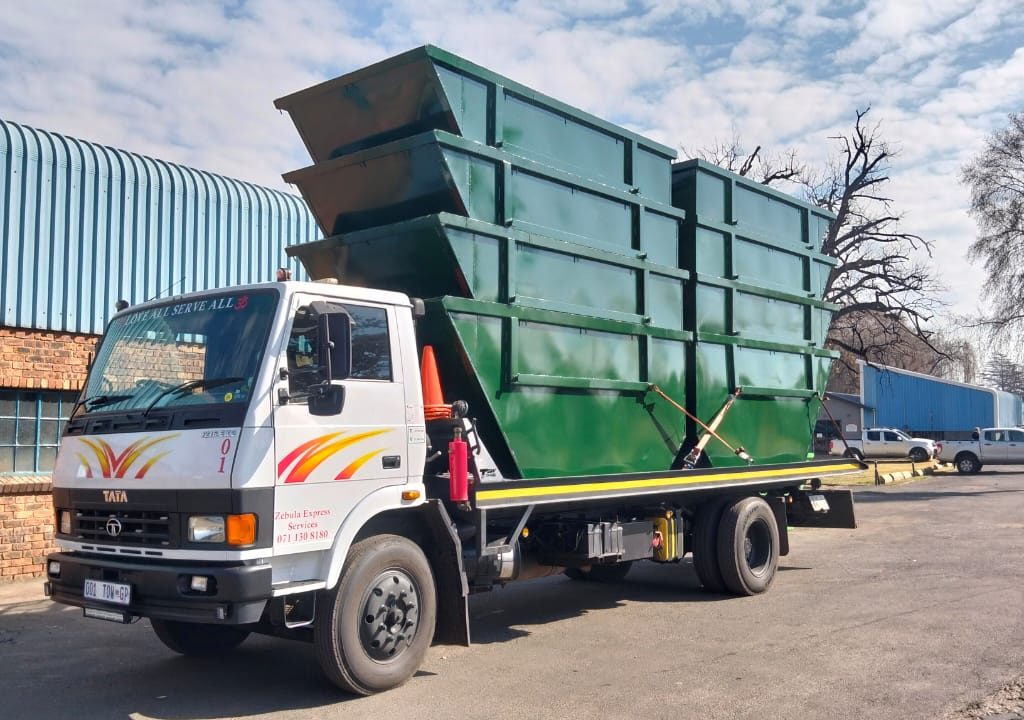 Skip bins loaded on trucks