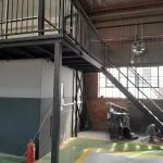 Steel mezzanine staircase and supporting columns